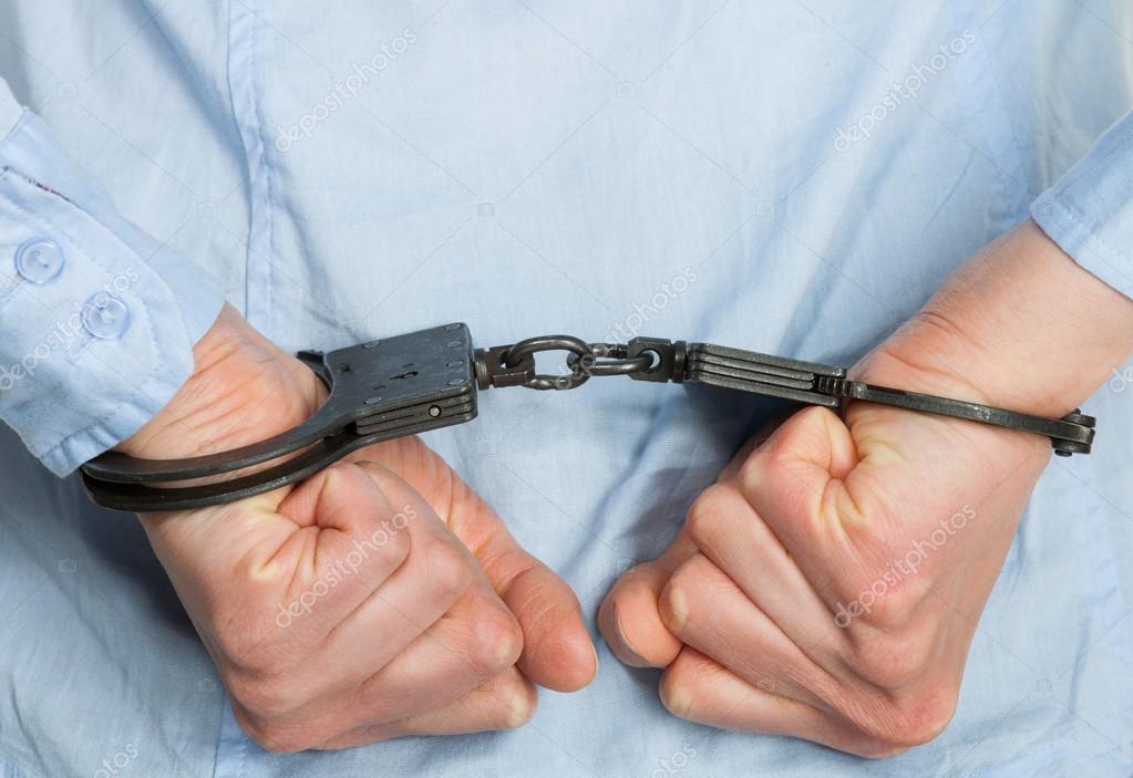 depositphotos 23666563 stock photo hands in handcuffs