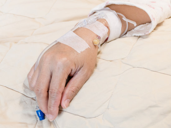 canva saline intravenous drip on woman hand