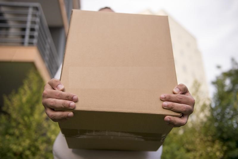 man holds carton box hands shipping delivery package parcel good depth field 155849483