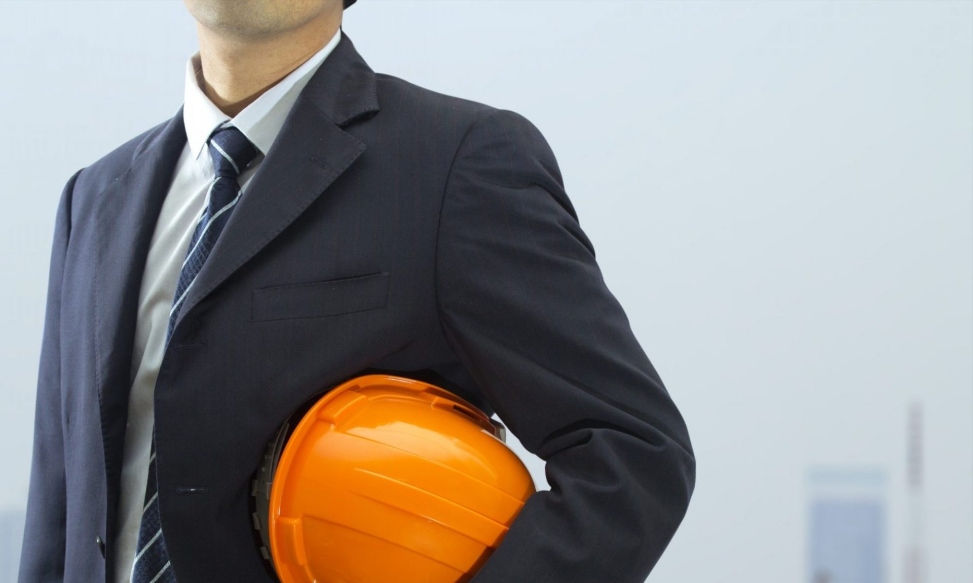 cropped Cropped view of engineer holding helmet